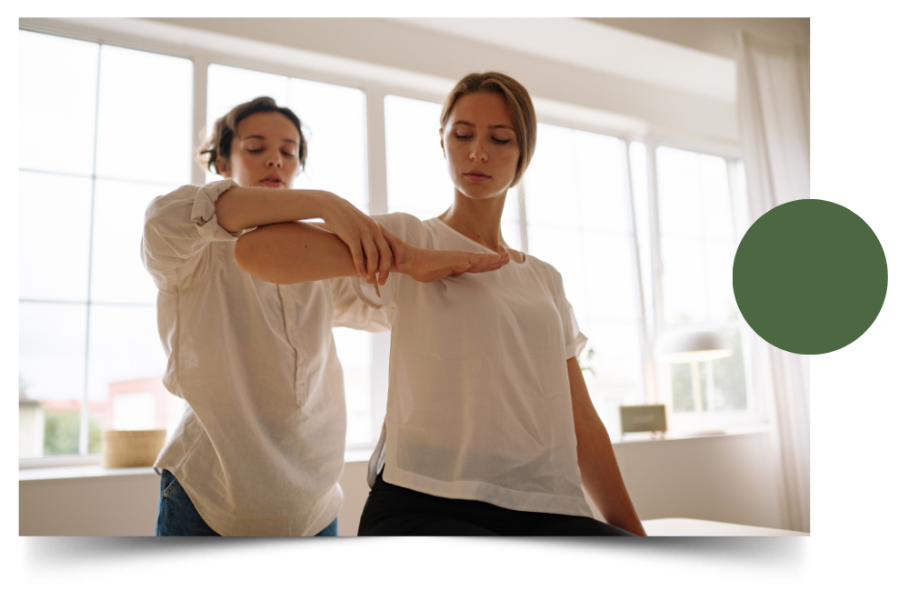 Therapist guiding a patient through a shoulder mobility assessment